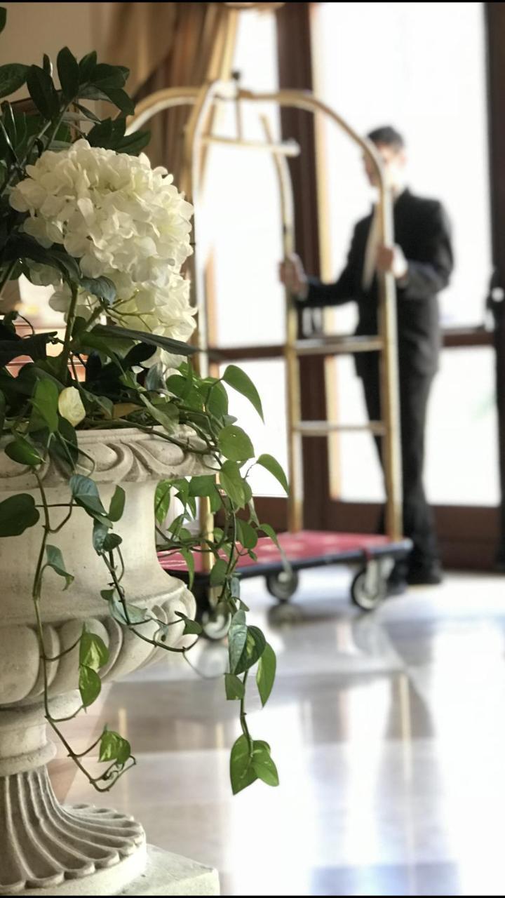 Grand Hotel Palace Marsala Ngoại thất bức ảnh A bellboy with a luggage cart